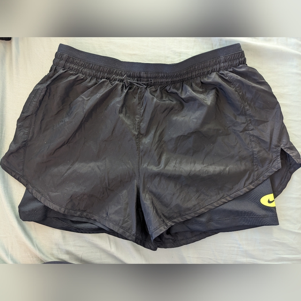 Nike Black Women's Athletic Shorts with Yellow Logo